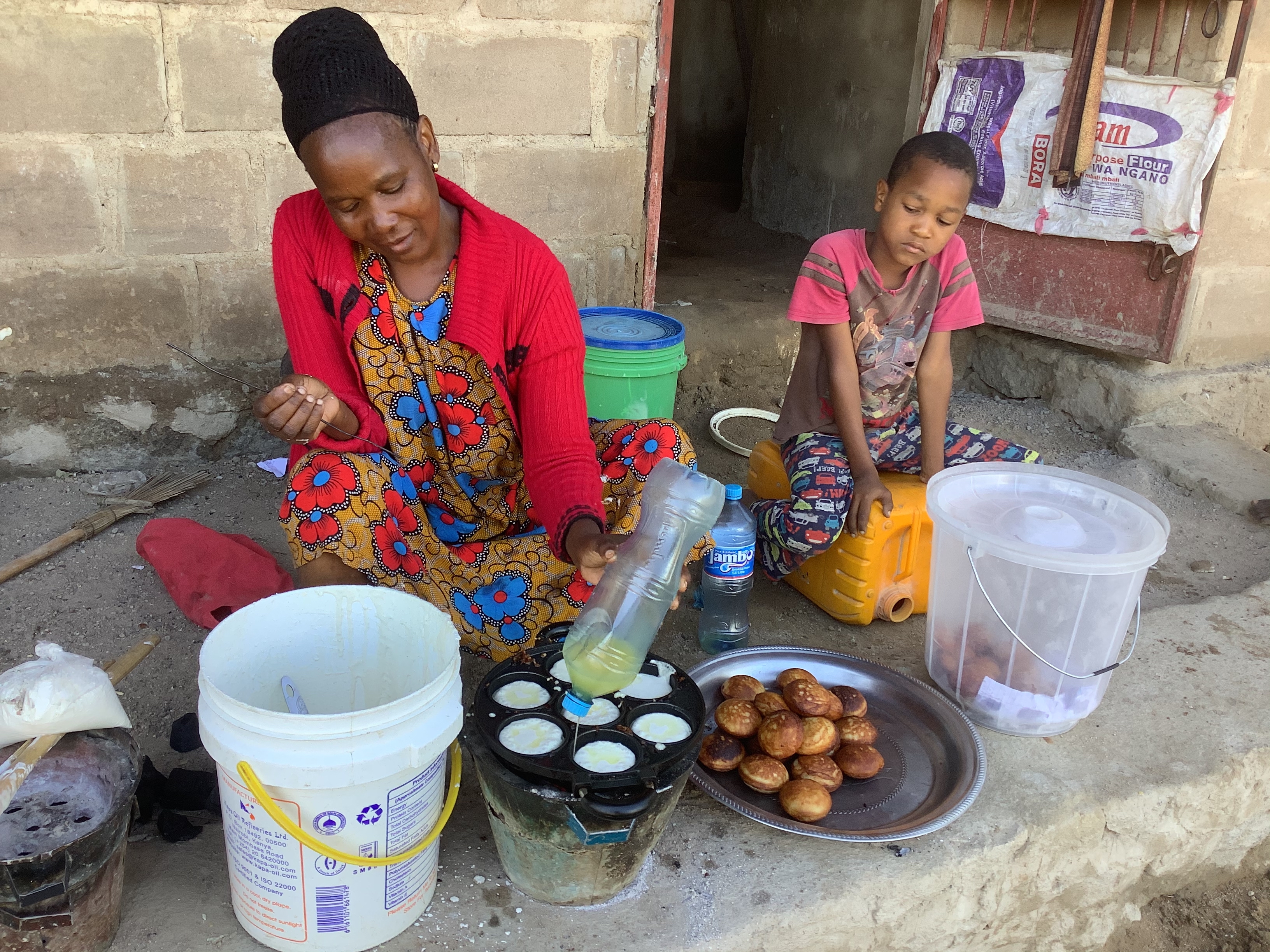 A woman cooks outside, Tanzania